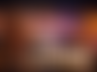 Blonde woman in a sparkling gold dress stands on a high-rise balcony overlooking the Las Vegas Strip at night, holding a champagne glass as the Bellagio fountains and neon skyline glow below, with bold text reading “Top 10 Must-Do Experiences in Las Vegas.”