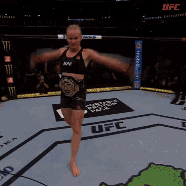 Valentina Shevchenko performing a traditional Kyrgyz victory dance after a fight.