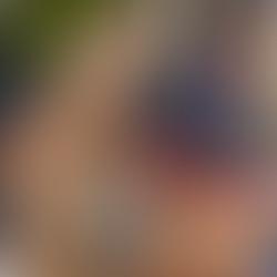 Evelyn Decker posing poolside in NFL team colors during her perfect playoff prediction run, blending sports betting superstition with Slay House style.