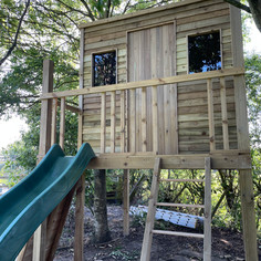 View of Bretherton playhouse, near Leyland Croston. With extra large playhouse, acrylic windows, slide, climbing wall, fireman pole