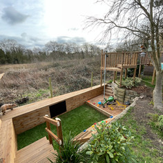 Burscough Ormskirk climbing frame Newburgh Rufford. Twin tower climbing frame, with rope bridge, slide, climbing wall, fireman pole, sandpit, artificial grass, wall cladding, crawl tunnel, bench with roof, chalkboard, blackboard