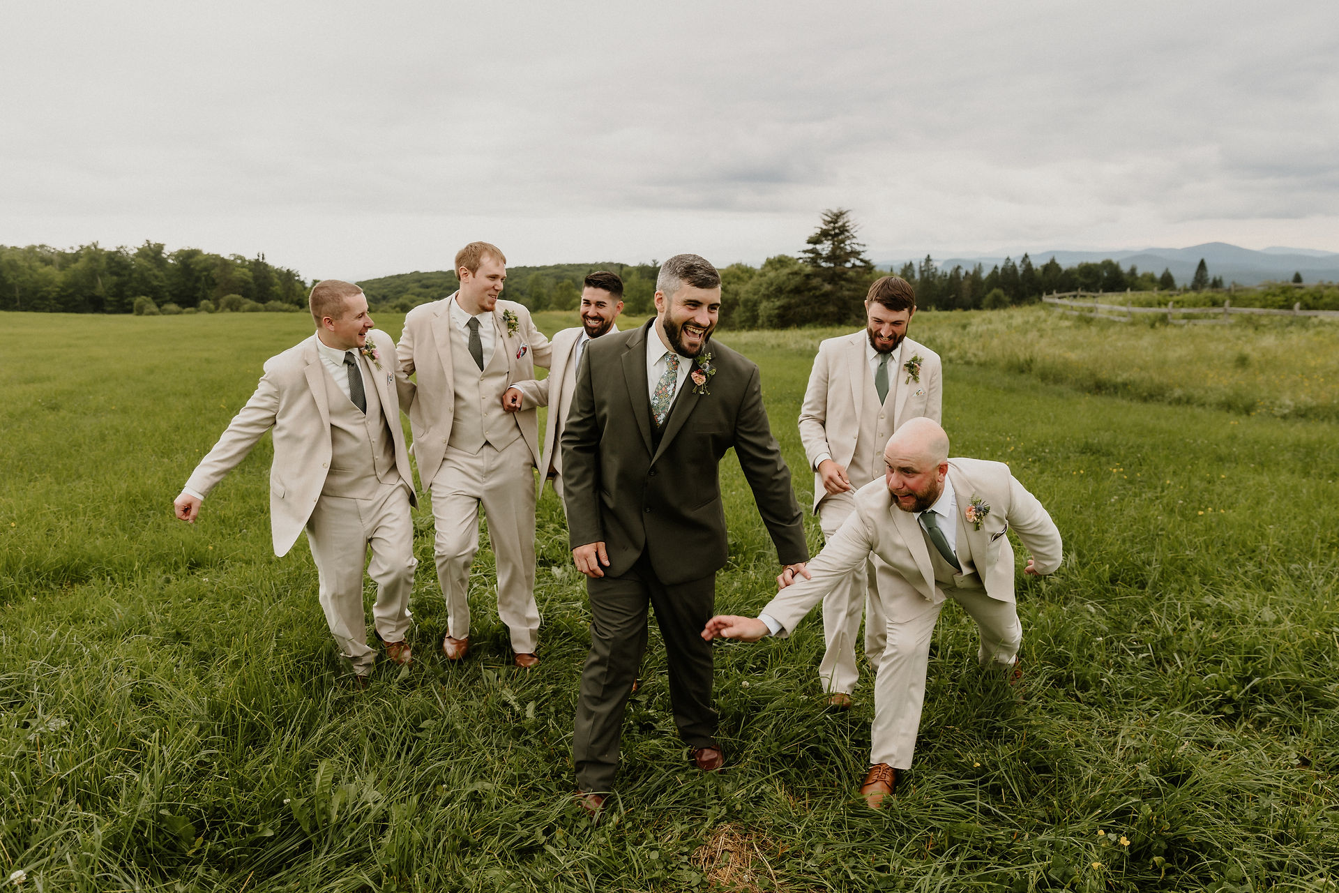 groom and groomsmen walk towards camera 