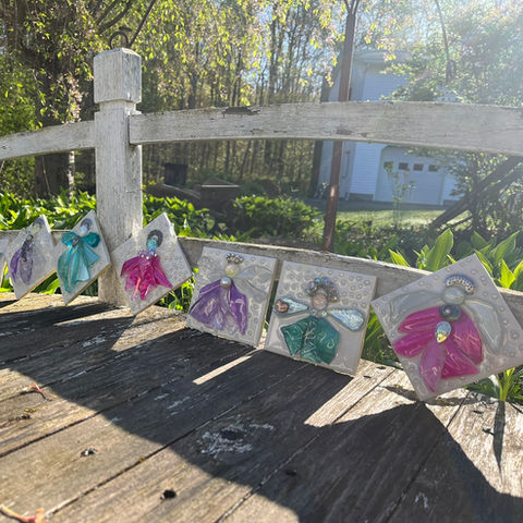 Many angel glass art displayed