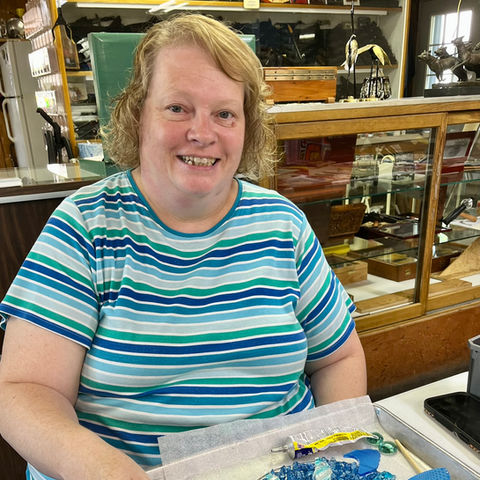 Woman smiling with her art