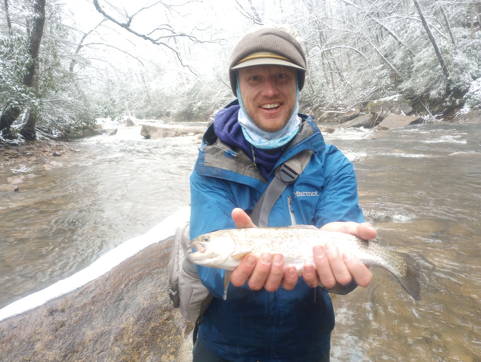 Man displaying a smallmouth bass.
