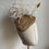 Thumbnail: Gold sinamay Tear Drop Beret with white feather firework