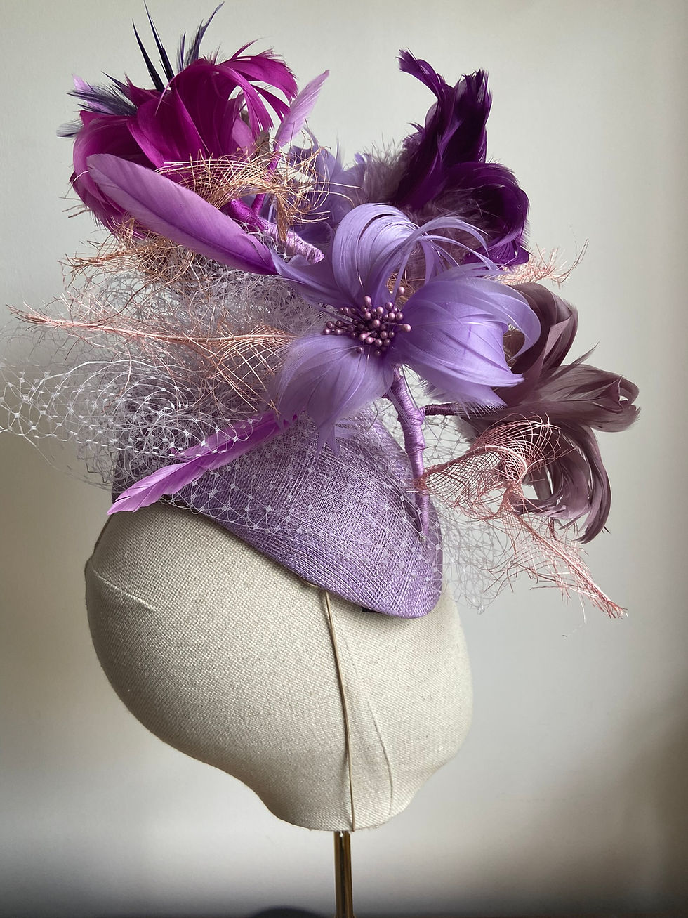 Thumbnail: Lilac Sinamay high Curved Teardrop with feather flowers in purple tones