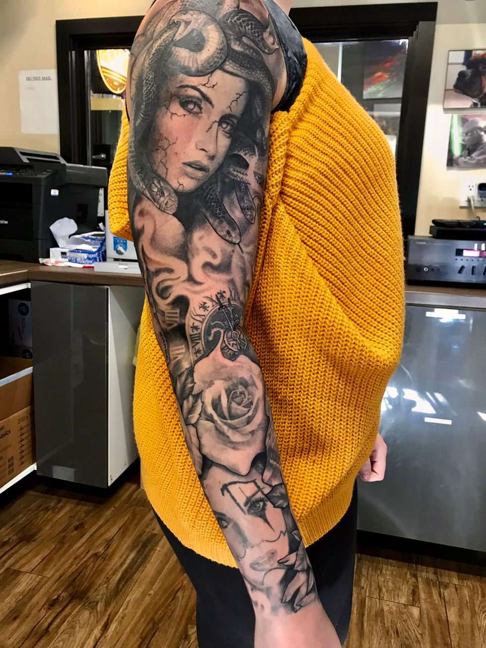 Black and grey woman, snakes, roses sleeve tattoo by Coatsie at Mythology Tattoo in Edmonton