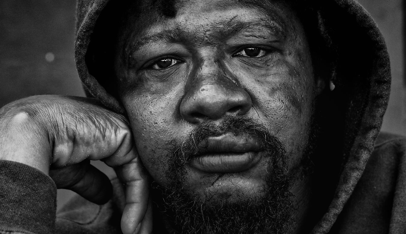 Black and white extreme close-up image of a homeless man.
