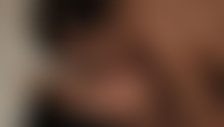 A mom kissing her baby