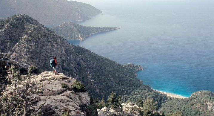Hiker overlooking the Mediterranean coast near Kalkan