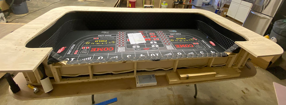 Sub-rail as the base for craps table arm rest and chip rail.