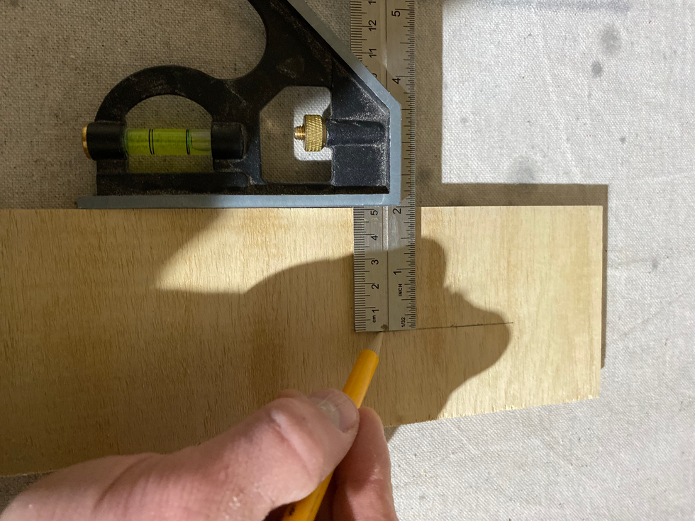 Demonstrating a Combo Square as Straight Edge