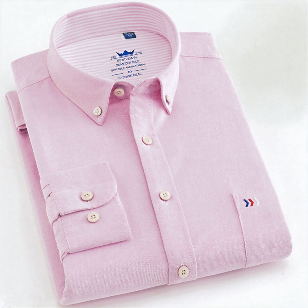 Folded pink shirt, front view.