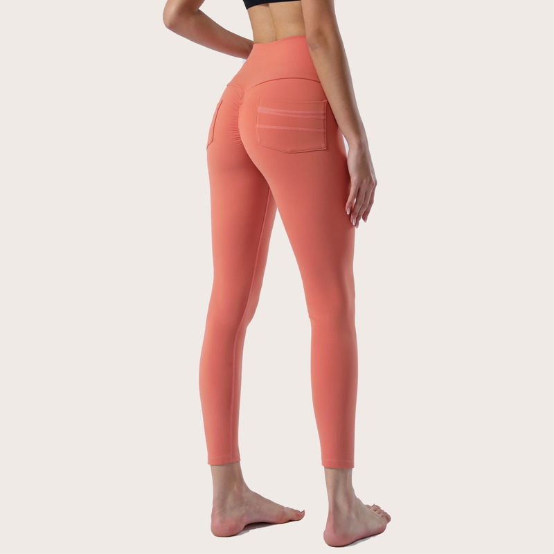 Thumbnail: Femme en pantalon de Yoga orang vue de derrière