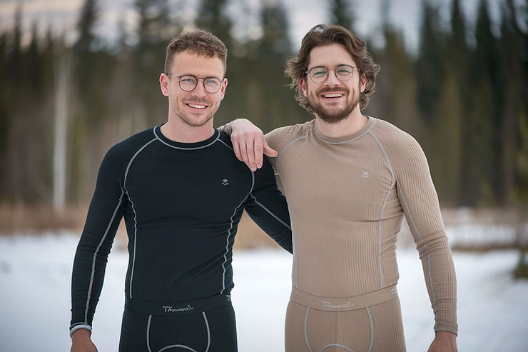 Portrait of two men wearing thermal underwear, black and milk chocolate, clear glasses, front view.