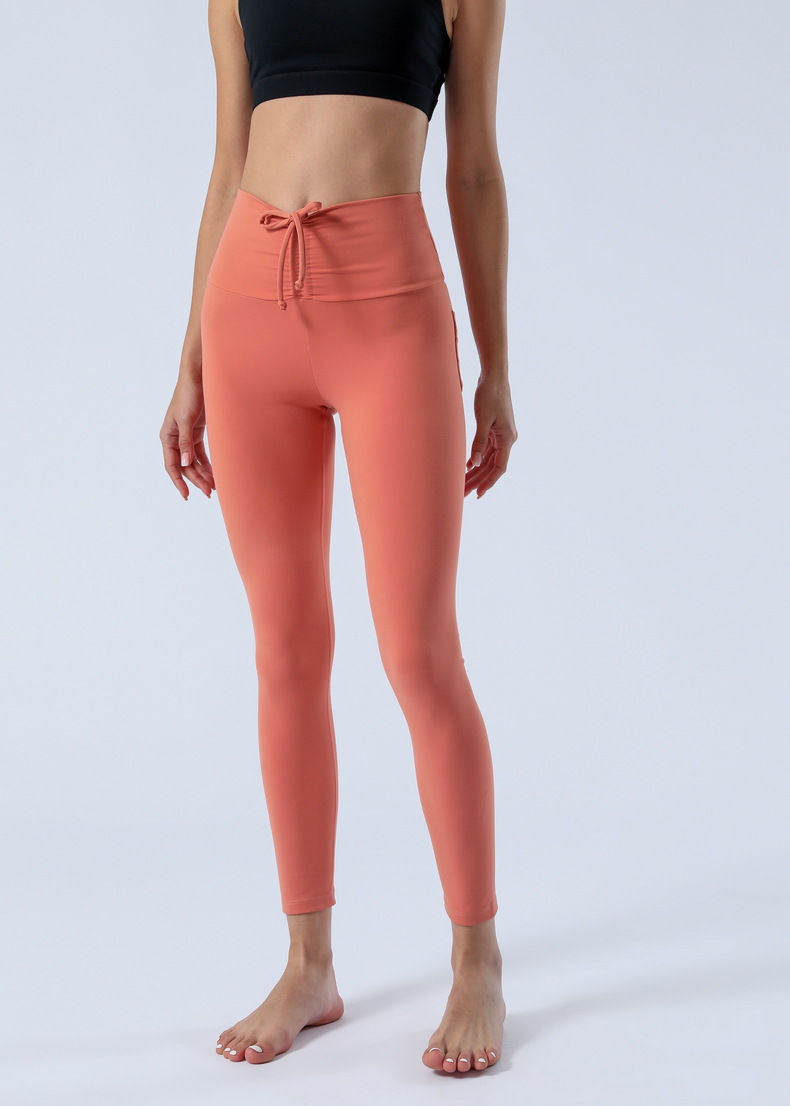 Miniature : Femme en pantalon de Yoga orange vue de face