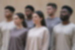 Portrait of six people including four men and two women, wearing long-sleeved t-shirts, showing logos, different colors, front view.