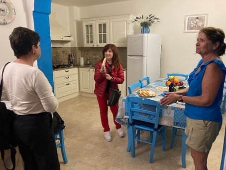 Francesca, our hostess, shows all of our food and drink welcome gifts.