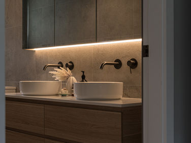 Mood lighting - LED strip lighting under the vanity mirror.