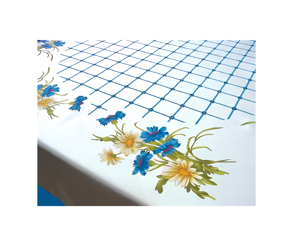 Hobbytex Cornflowers and Daisies Tablecloth with blue flowers, yellow daisies and criss-cross detail.