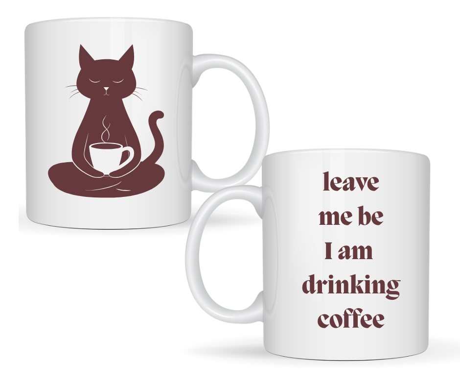 Front of mug sitting coffee in lap, back of mug - leave me be I am drinking coffee