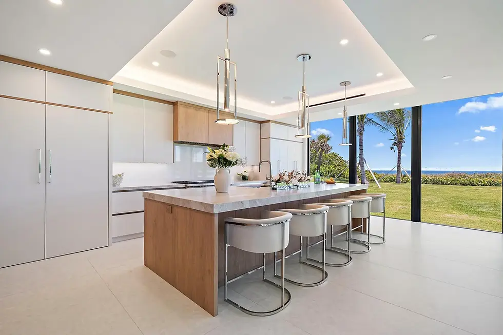 Custom kitchen with island, warm finishes, and open layout by LAS Studio