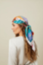 Shobha printed silk scarf by Kalpanik worn on the head by a model