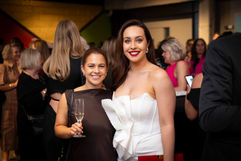 Two guests with drinks at a corporate function in Christchurch – social portrait by Display Commercial Photography.