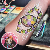 Mardi Gras king cake face paint for private event in Uptown New Orleans, LA.