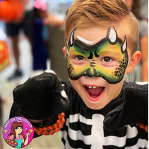Face painting dinosaur design at Halloween event in Metairie, LA