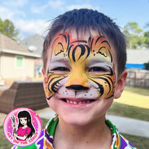 Tiger face paint at birthday party in Mandeville, LA.