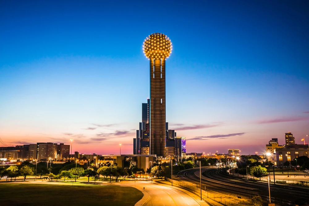 The Reunion Tower stands at sunset in Dallas.