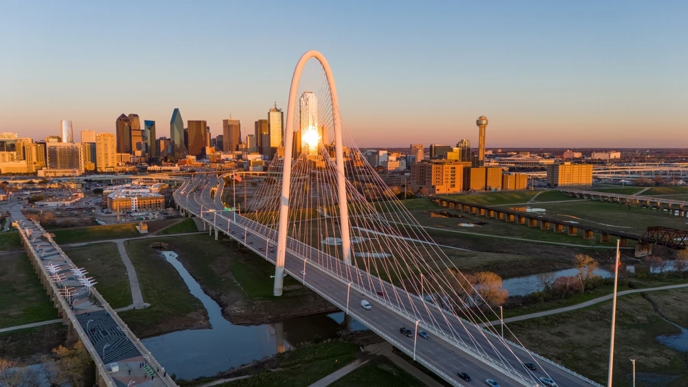 Aerial view of Dallas skyline at sunset.