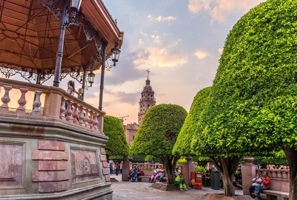 Polished trees and kiosk at Plaza de los Mártires, the main plaza in Leon Gto.