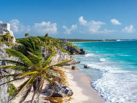 Tulum beach with turquoise water and Mayan ruins during the best time to travel to Mexico.