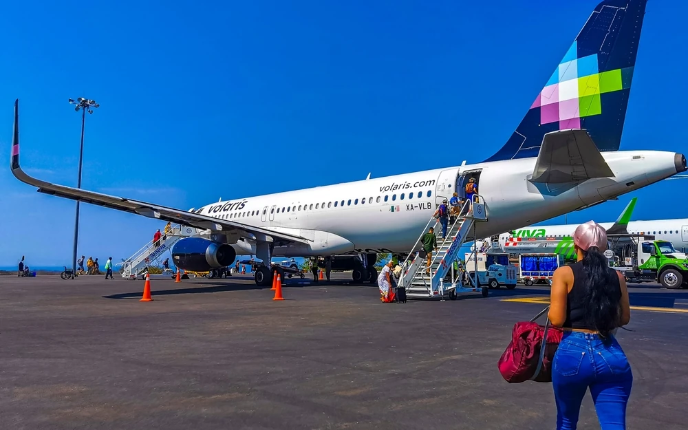 People boarding on a Volaris airbus.