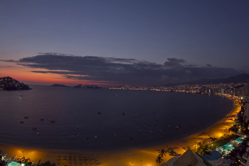 Panoramic view of Acapulco shore at night.
