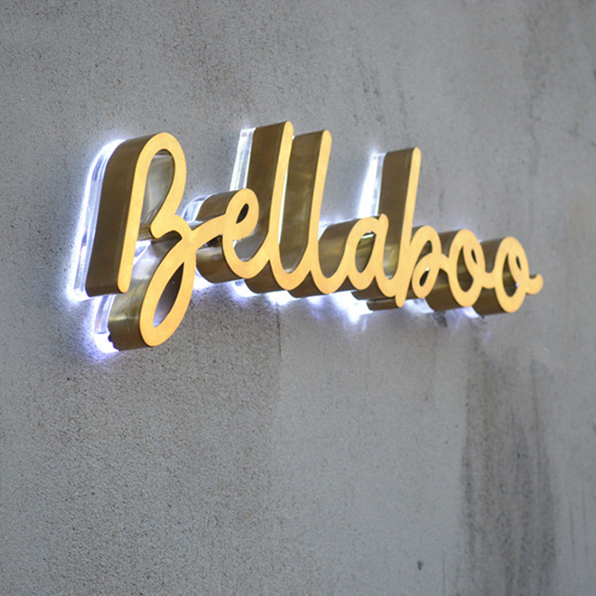 Indoor halo illuminated brushed brass channel letters sign 3dI logo