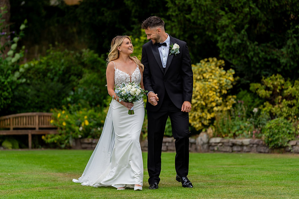 Candid wedding bride and groom laughing