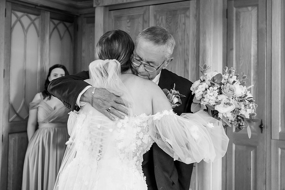 Couple viewing wedding sneak peek photos on tablet
