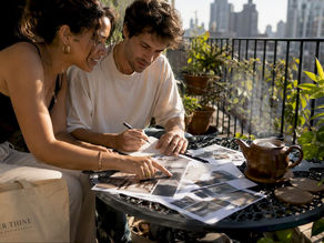 Couple preparing photography brief at table