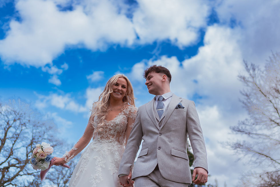 Couple walking at historic wedding venue gardens