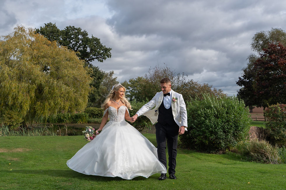 Photographer prompts laughing couple candidly outdoors