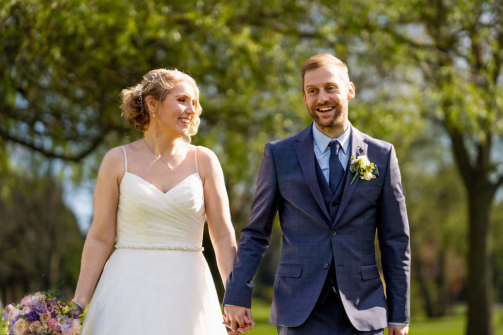 Close-up view of a wedding album with candid couple photos