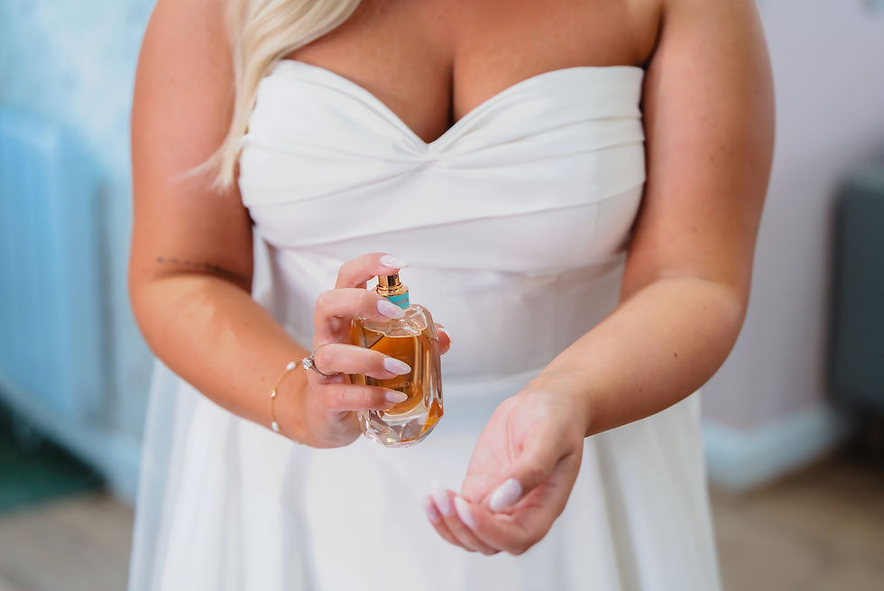 Close-up view of a vintage camera on a wooden table with wedding rings