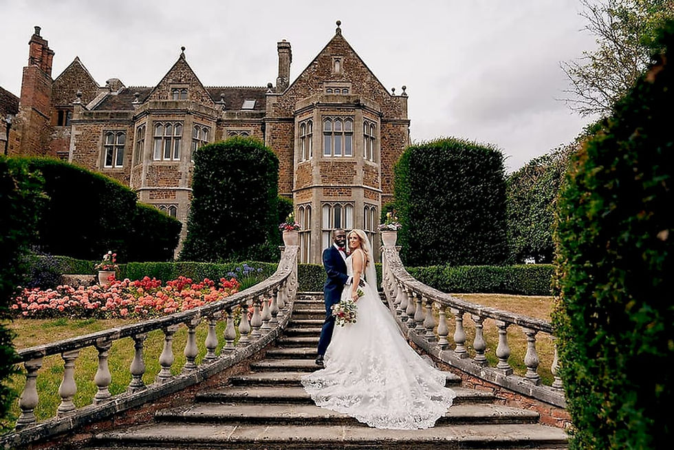 Wide angle view of a wedding venue decorated with fairy lights and floral arrangements