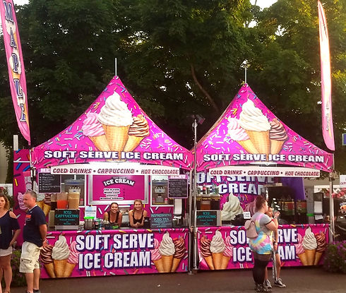 Soft Serve Ice Cream concession stands by North Country Specialty Foods with colorful graphics, at outdoor event