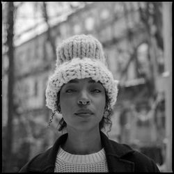 Black and white film portrait on Hasselblad 500c, model looking at camera wearing knit hat during sn