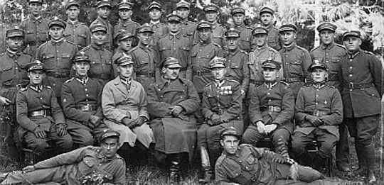 Menashe Pizer and his army platoon, Przshnev, Poland. Menesha is the first person on left in the middle row standing.